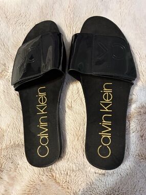 Calvin Klein Black Patent Slide Sandals with Gold Logo